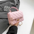 Pink quilted crossbody bag with gold chain strap and metallic twist lock closure - Pink