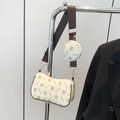 Schicke beige Umhängetasche mit Vintage-Blumenmuster und passendem kleinen Münzfach - Weiß