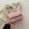 Elegant pink quilted leather crossbody bag with V-pattern and gold metal chain strap - Pink