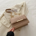 Minimalist dusky pink crossbody bag with V-shaped quilting and gold metal bar detail - Khaki