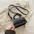Minimalist black lychee texture crossbody bag with adjustable strap and top handle - Black