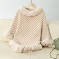 Detail of chunky knit poncho sweater with plush faux fur collar and textured weave - Letter F / Apricot