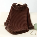 Detail of chunky dark brown knit poncho showing textured weave and plush faux fur trim - Letter F / Coffee