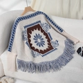 Bohemian off-shoulder knit poncho sweater in beige with blue floral jacquard and tassels - Letter F / Apricot