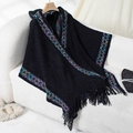 Black hooded knit poncho with colorful patterned trim and fringe details for women - Letter F / Black