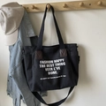 Grand sac fourre-tout en toile noire avec lettrage blanc et détails en cuir marron - Noir