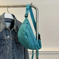 Minimalist light blue nylon fanny pack with adjustable strap and braided zipper pulls - Lake Blue