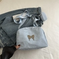 Light blue pleated crossbody bag with silver butterfly and matching small round pouch - Blue