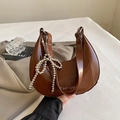 Deep brown crescent moon handbag in glossy patent leather with silver beaded bow charm - Brown