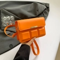 Minimalist small square crossbody bag in vibrant orange leather with gold metal accent - Orange