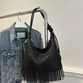 Chic black litchi grain tote bag with long vertical tassels and knot shoulder strap - Black