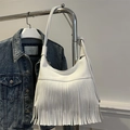White hobo shoulder bag featuring stylish leather fringe tassels and litchi grain texture - White