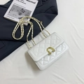 Elegant white quilted chain bag with gold U-shaped hardware and leather strap detail - White