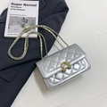 Chic silver quilted shoulder bag with gold horseshoe buckle and elegant chain strap - Silver