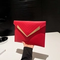 Elegant red faux leather envelope clutch with V-shaped stitching and gold metal trim - Red