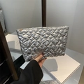 Silver heart-quilted clutch bag with gold zipper and textured synthetic leather - Silver