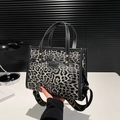 Fashionable leopard print tote bag in black and grey with adjustable wide logo shoulder strap - Black