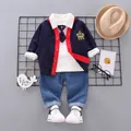 Flat lay of boy's 4-piece set including navy cardigan, white polo, and denim pants - 80cm / Navy Blue