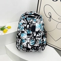 Mochila graffiti de moda en negro blanco y azul con colgante de astronauta casual - Verde