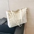 White tote bag in glossy leather and transparent PVC with side ribbon bow details - White