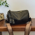 Retro black pillow bag with geometric woven strap and gold-tone fashion hardware - Black