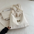White butterfly tote bag featuring marble pleated texture and silver butterfly buckle - White