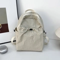Minimalist beige waterproof nylon backpack with drawstring pocket and large main compartment - Off White