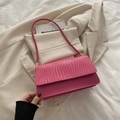 Pink rectangular shoulder bag featuring a unique wave-textured woven leather flap design - Pink