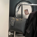 Minimalist black tote bag in lychee texture with golden buckles and small card pouch - Black