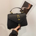 Elegant black handbag with woven texture flap and gold buckle for a stylish look - Black