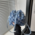 Blue and white plaid denim bucket bag with distressed fringe and leather drawstring - Checkered Blue