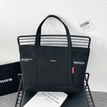 Large black canvas tote bag with white industrial print and durable wide handles - Black
