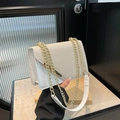White textured square handbag with cream woven flap and gold chain strap handle - White