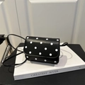 Mini black leather crossbody bag with white polka dot pattern and slim strap - Black