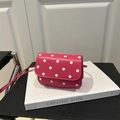 Mini crossbody bag with white polka dot patterns on pink leather and a slim strap - Rose Pink