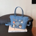 Blue denim tote bag with vintage cat prints and an adjustable crossbody strap - Light Blue