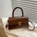 Vintage brown oil wax leather handbag with gold buckle and top handle for crossbody wear - Tan