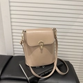 Minimalist beige bucket bag with leather texture and golden drop-shaped lock - Khaki
