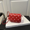 Mini red crossbody bag with white polka dots on synthetic leather and flap closure - Red