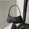 Classic black leather underarm bag with a decorative gold bow metal hardware - Black