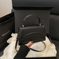 Minimalist black matte square handbag with gold hardware and removable shoulder strap - Black