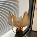 Elegant champagne gold sequin hobo bag with a silver metal bow and shiny leather strap - Gold