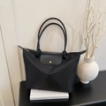 Classic black nylon tote bag with leather handles and gold snap button closure - Black