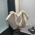 Classic black and white houndstooth tote bag with wide logo strap for chic commuting - White