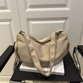 Minimalist beige nylon crescent crossbody bag with adjustable wide strap and pleated detail - Khaki