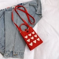 Mini red knitted crossbody bag with white heart patterns and a red shoulder strap - Red