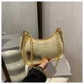 Chic metallic gold crescent underarm bag with glossy texture and fine chain strap - Gold