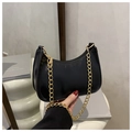 Glossy black crescent hobo bag with a thick gold chain strap in minimalist style - Black
