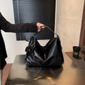 Elegant black leather tote bag with wide strap and silver chain coin purse detail - Black