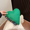 Vibrant green heart-shaped handbag with textured leather and LOVE embroidered strap - Green